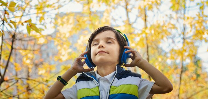 photo of a boy listening in headphones