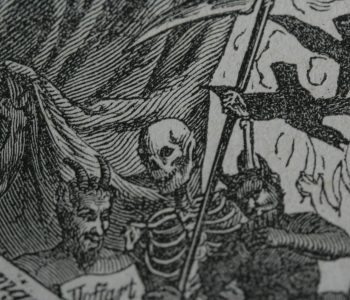 black and white page with death and devils
