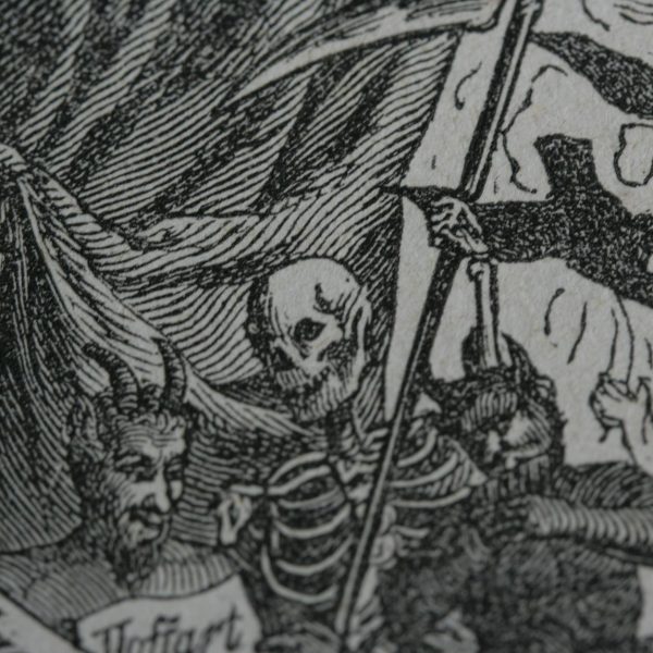 black and white page with death and devils