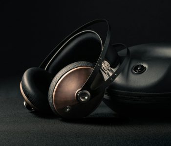 modern headphones with box placed on black surface