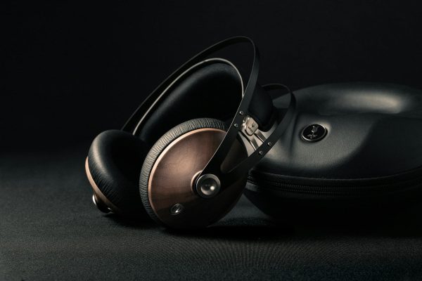 modern headphones with box placed on black surface