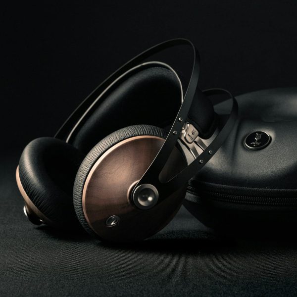 modern headphones with box placed on black surface