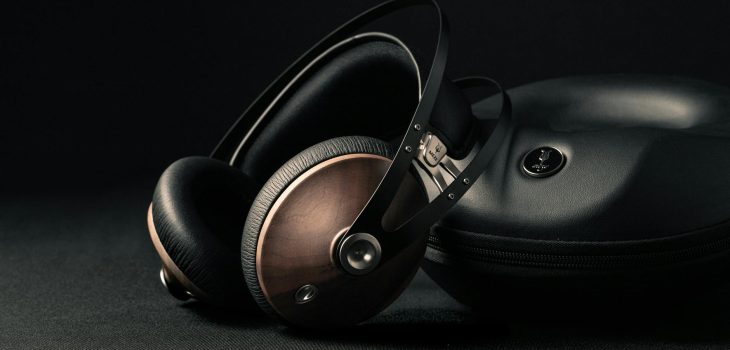 modern headphones with box placed on black surface