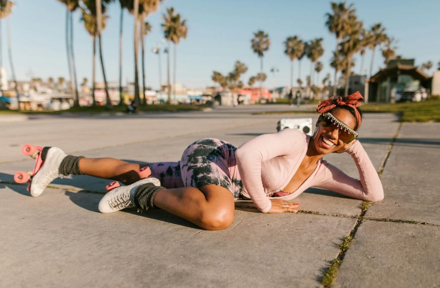 woman wearing rollers skates lying on the floor