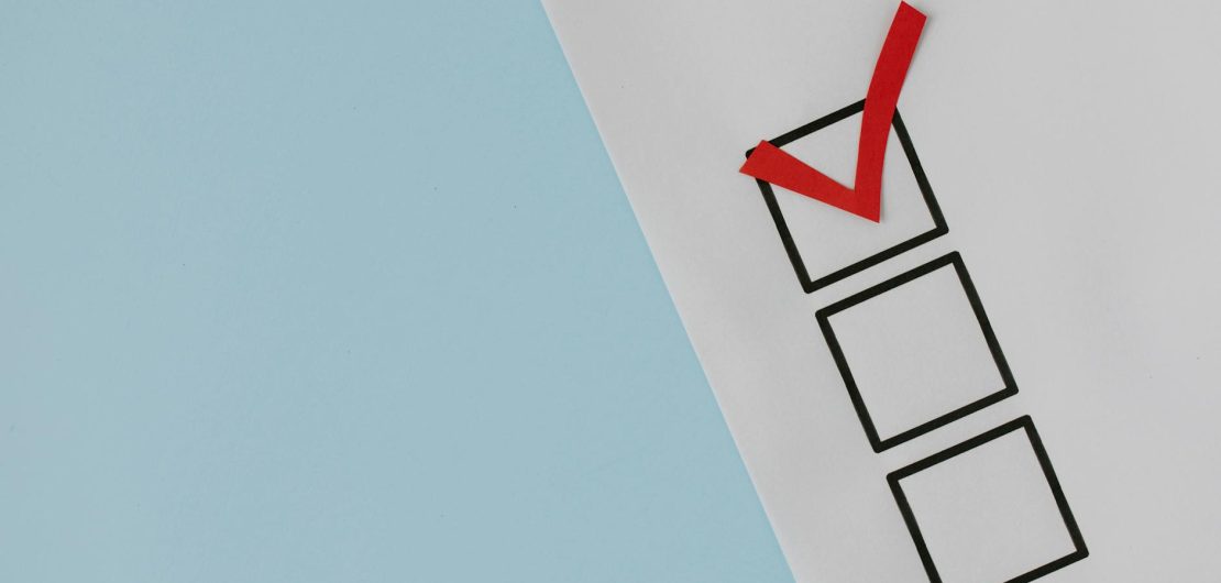red check mark over black box