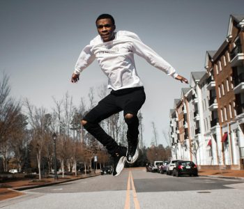 man jumping on road