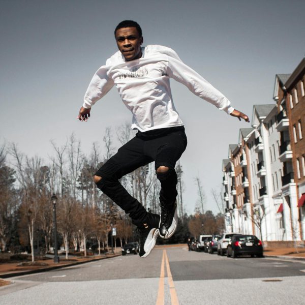 man jumping on road