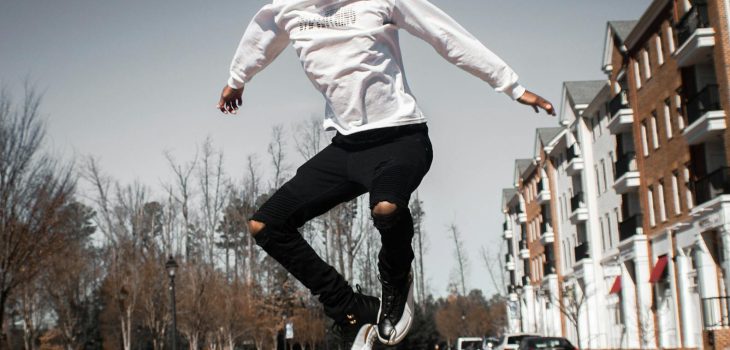 man jumping on road