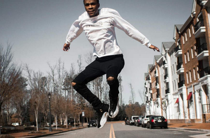 man jumping on road