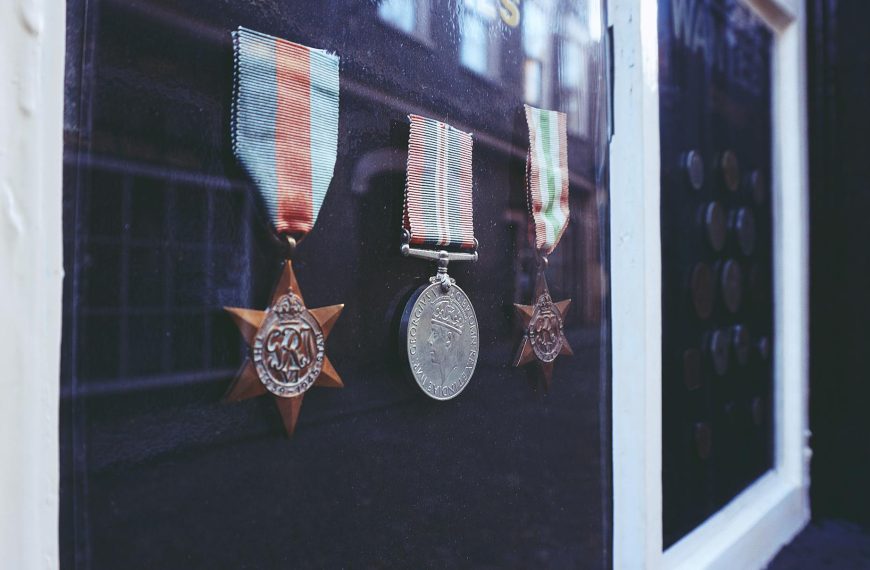 three medals in glass enclosure