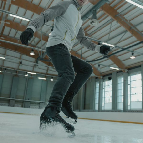 man in white long sleeve shirt and black pants doing stunts