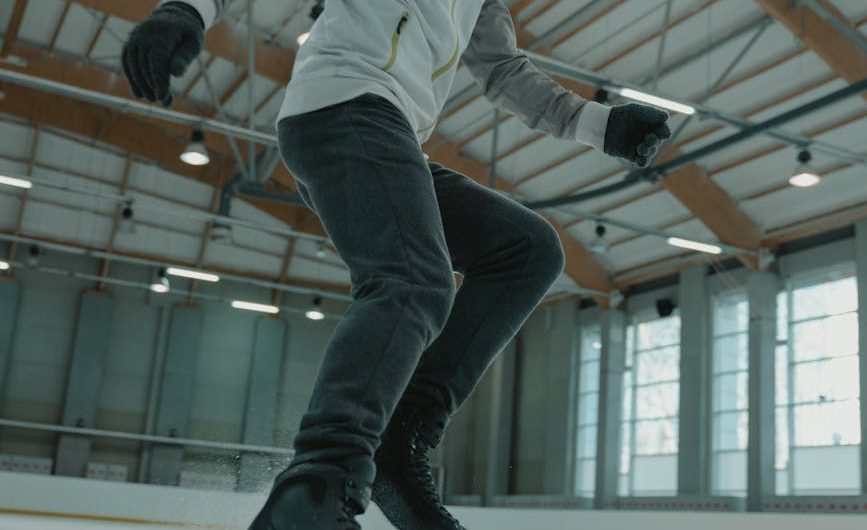 man in white long sleeve shirt and black pants doing stunts