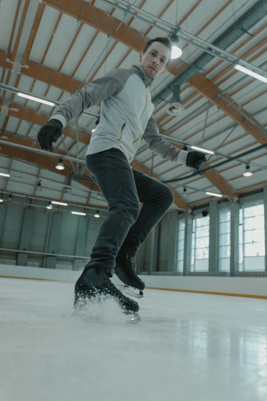 man in white long sleeve shirt and black pants doing stunts