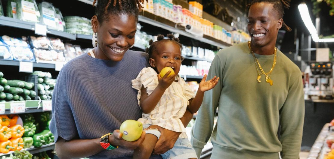 a family buying groceries in a supermarket