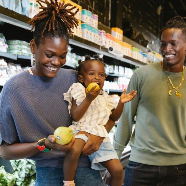 a family buying groceries in a supermarket