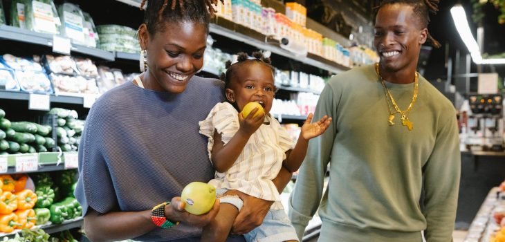 a family buying groceries in a supermarket