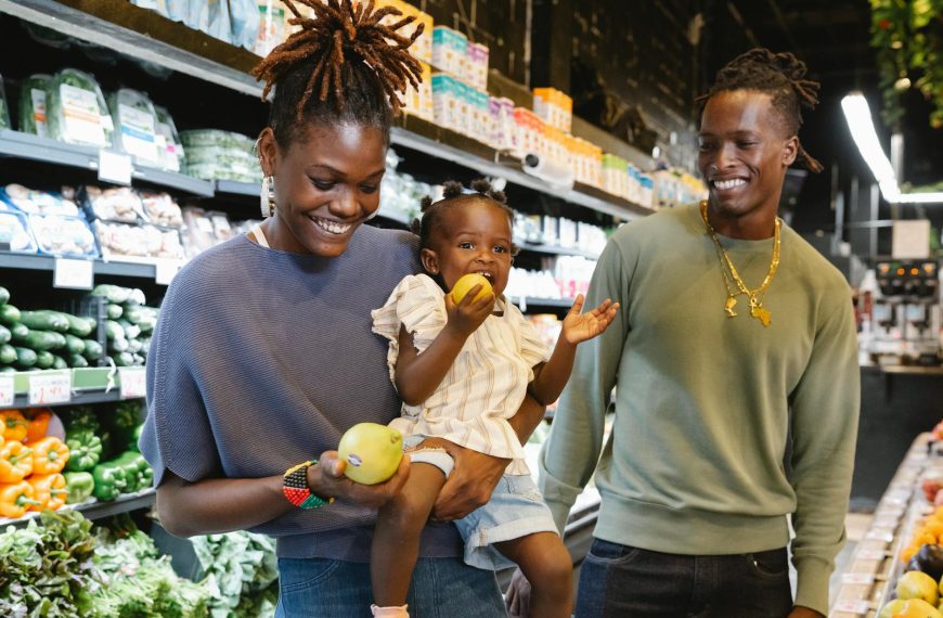 a family buying groceries in a supermarket